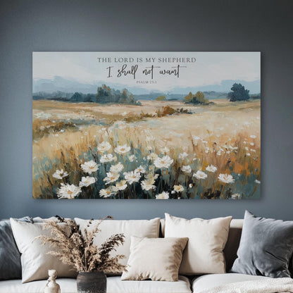 a large canvas print of a pastoral landscape with a field of white flowers, hanging on a wall above a couch with pillows.