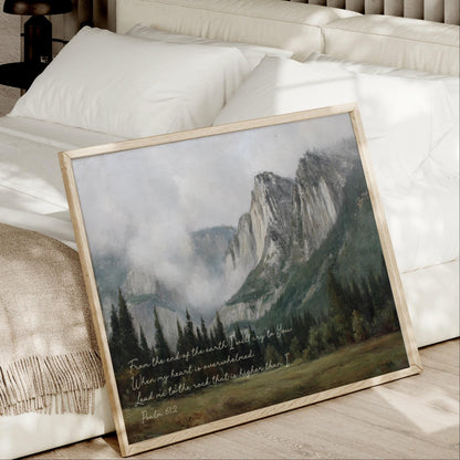 A framed painting of a mountainous landscape with a text overlay that reads "From the end of the earth I will die to you. When my heart is overwhelmed, lead me to the rest that is higher than I. Psalm 112".