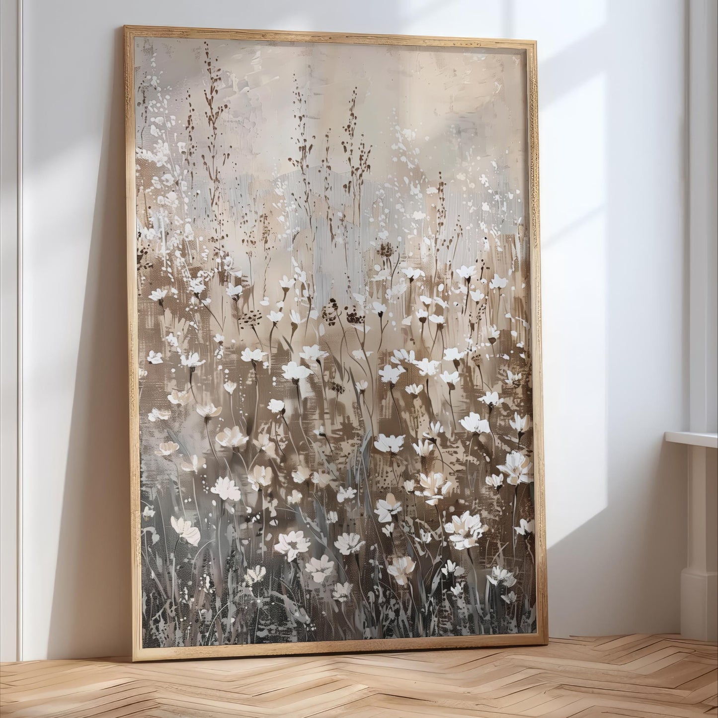 a large, framed painting of a field of white flowers against a light brown background.