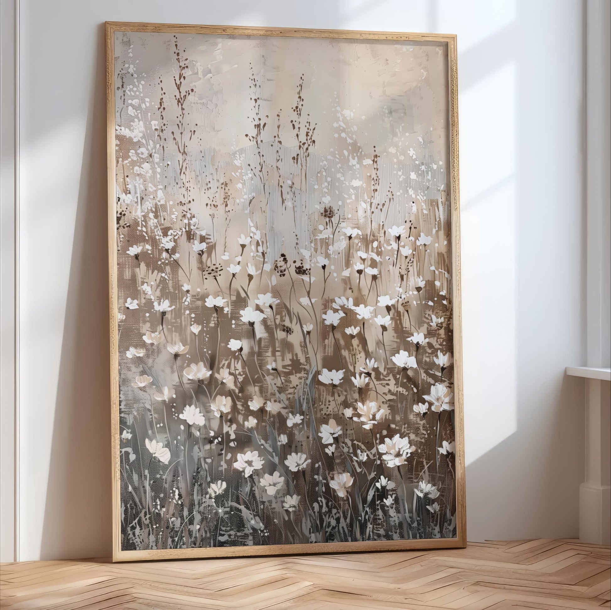 a large, framed painting of a field of white flowers against a light brown background.