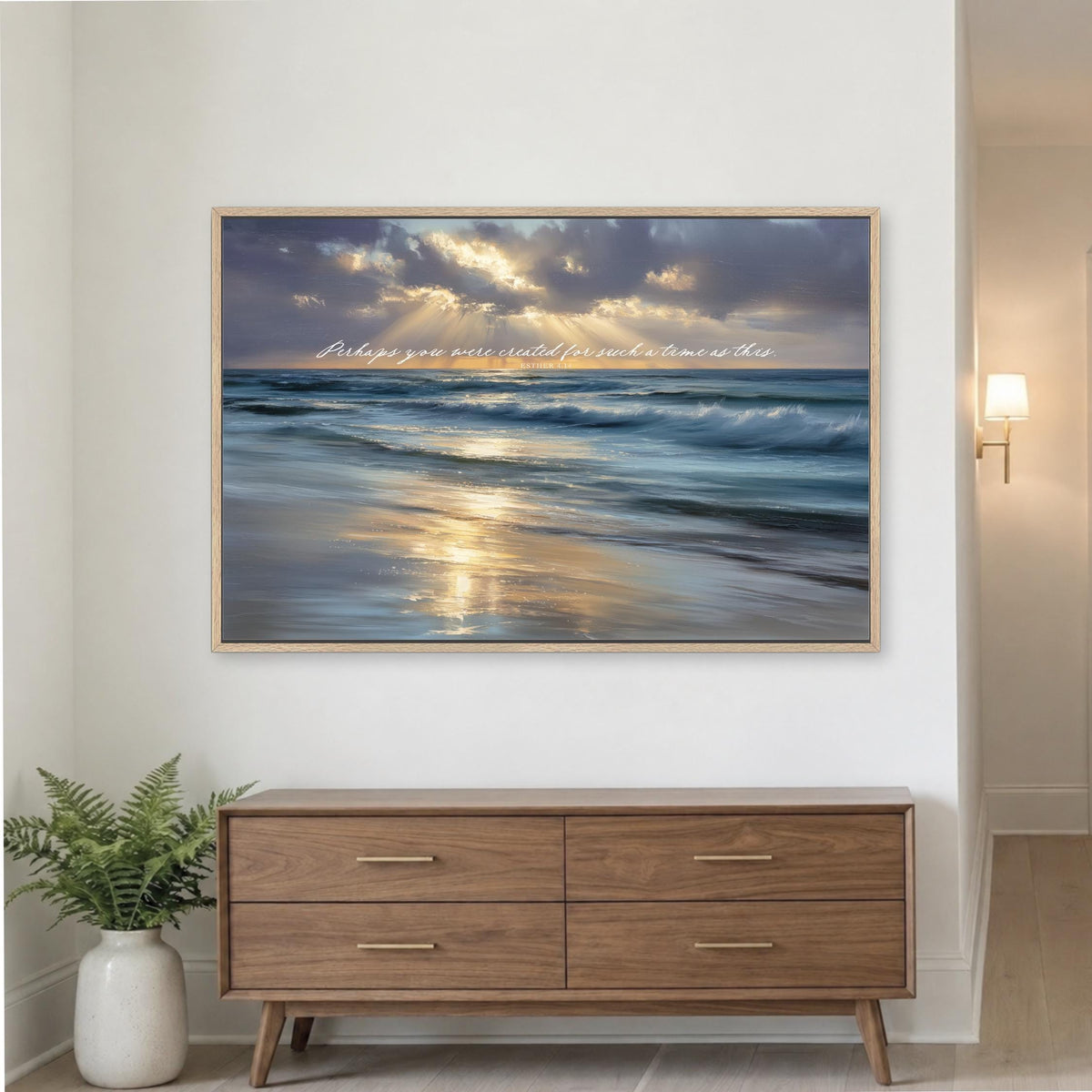 a serene beach scene with a wooden dresser below it.