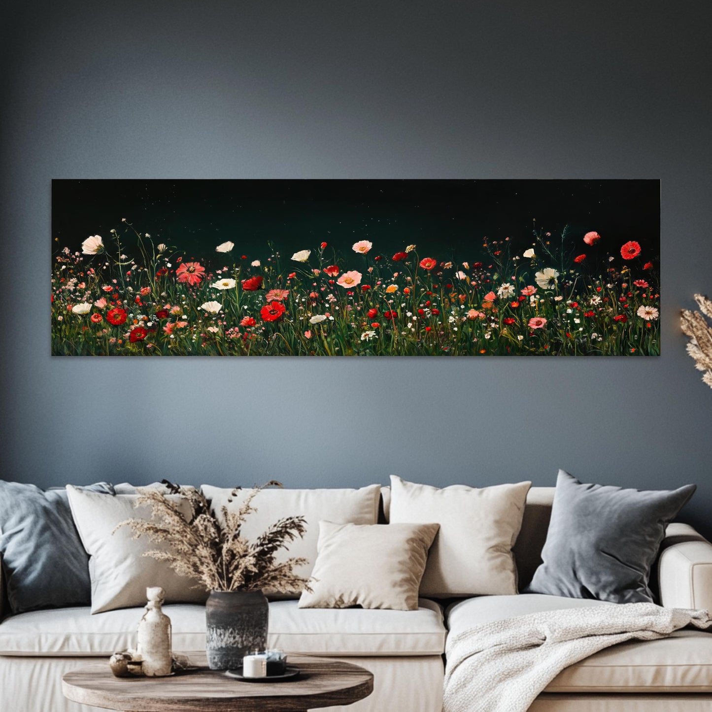 a living room with a couch and a painting on the wall