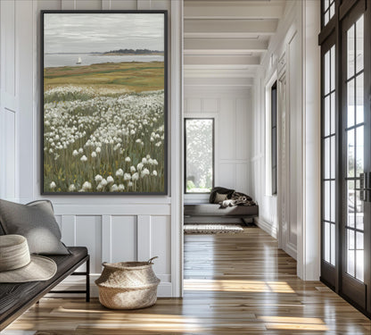 a serene and well-lit living room with a large painting of a field of white flowers hanging on the wall. The room has a wooden floor and white walls, creating a warm and inviting atmosphere.