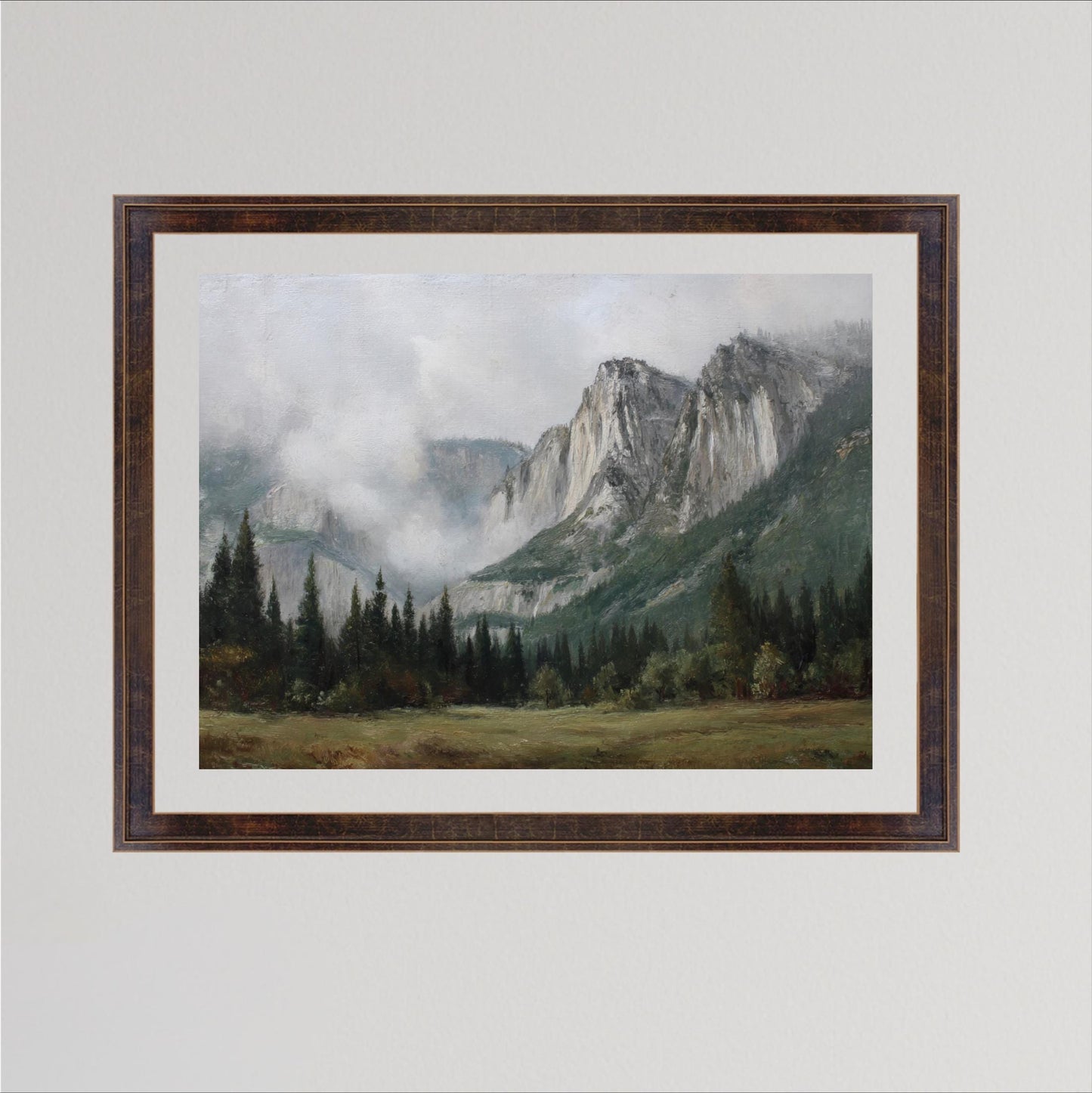 The image is a framed painting depicting a mountainous landscape with a forested area in the foreground and a misty, hazy mountain range in the background.
