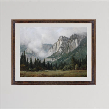 The image is a framed painting depicting a mountainous landscape with a forested area in the foreground and a misty, hazy mountain range in the background.