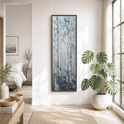 a serene and modern living room with a large window, a painting of a forest, and various decorative elements such as potted plants and a vase.
