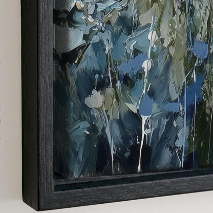 The image is a framed painting depicting a lush, green forest scene with a mix of blue, green, and white colors.