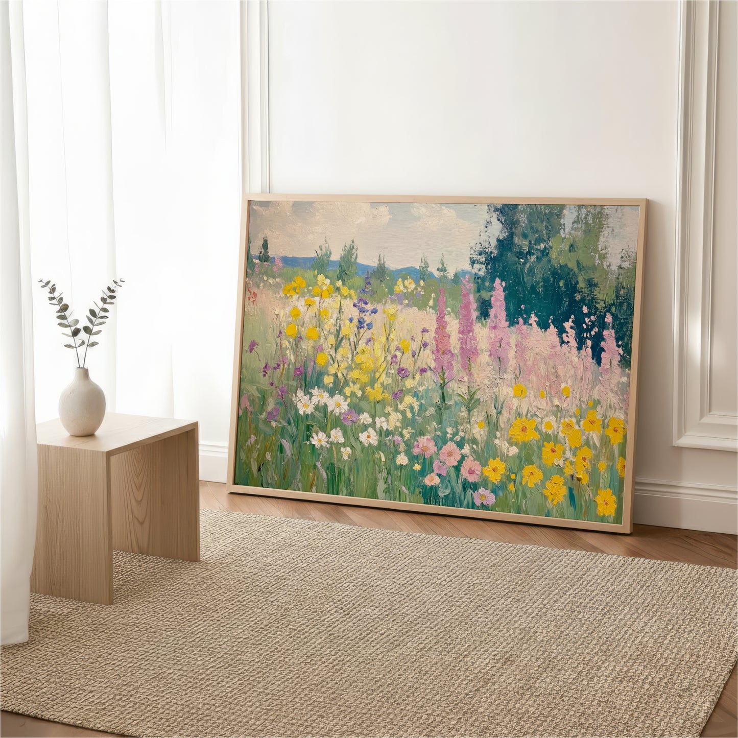 a large painting of a colorful garden with various flowers and plants, displayed on a wall in a room with a wooden table and a vase of flowers.