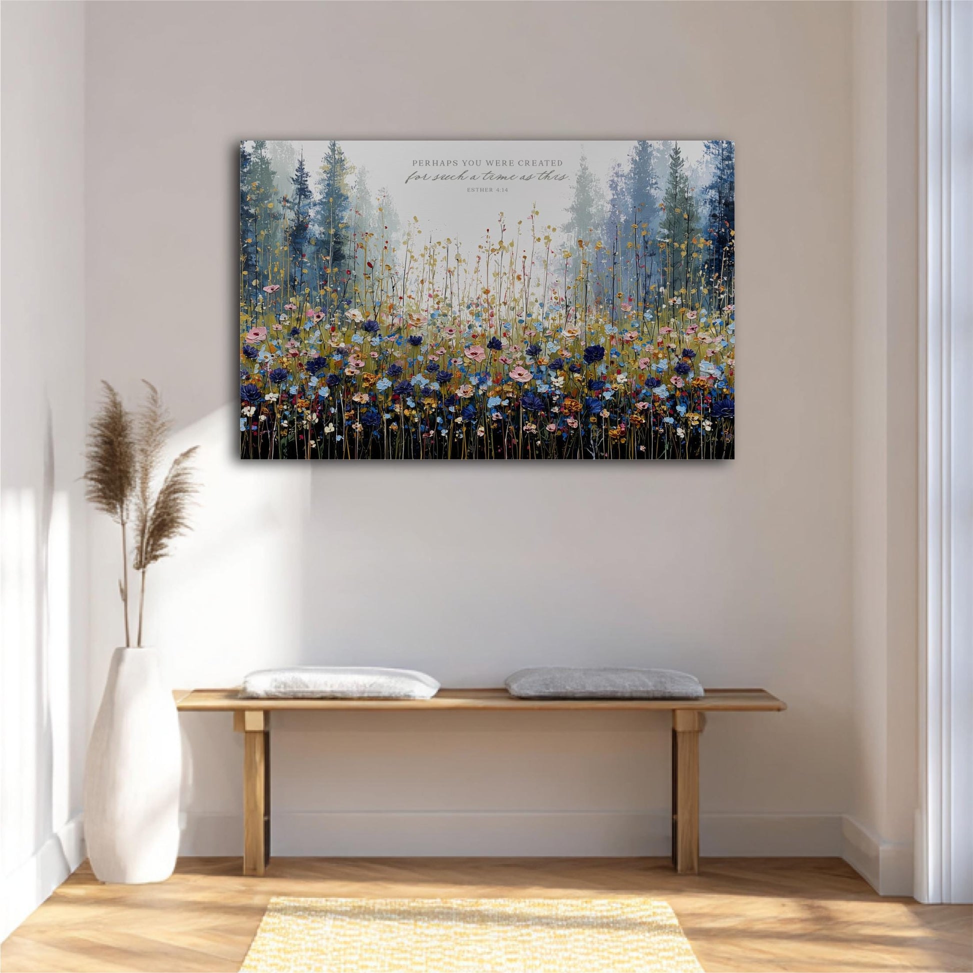 a large, colorful painting of a field of flowers hanging on a wall above a wooden bench.