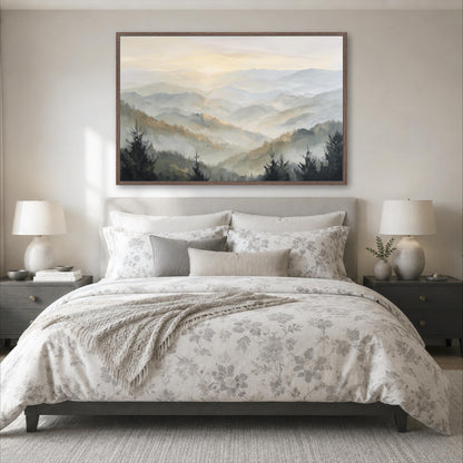 a serene bedroom scene with a large bed adorned with a floral comforter and pillows, flanked by two nightstands with lamps. Above the bed, a large framed landscape painting of a mountain range with a hazy, misty atmosphere is displayed on the wall.
