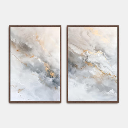two abstract paintings with a marble-like texture, featuring a combination of white, gray, and gold colors. The paintings are framed and displayed on a wall.