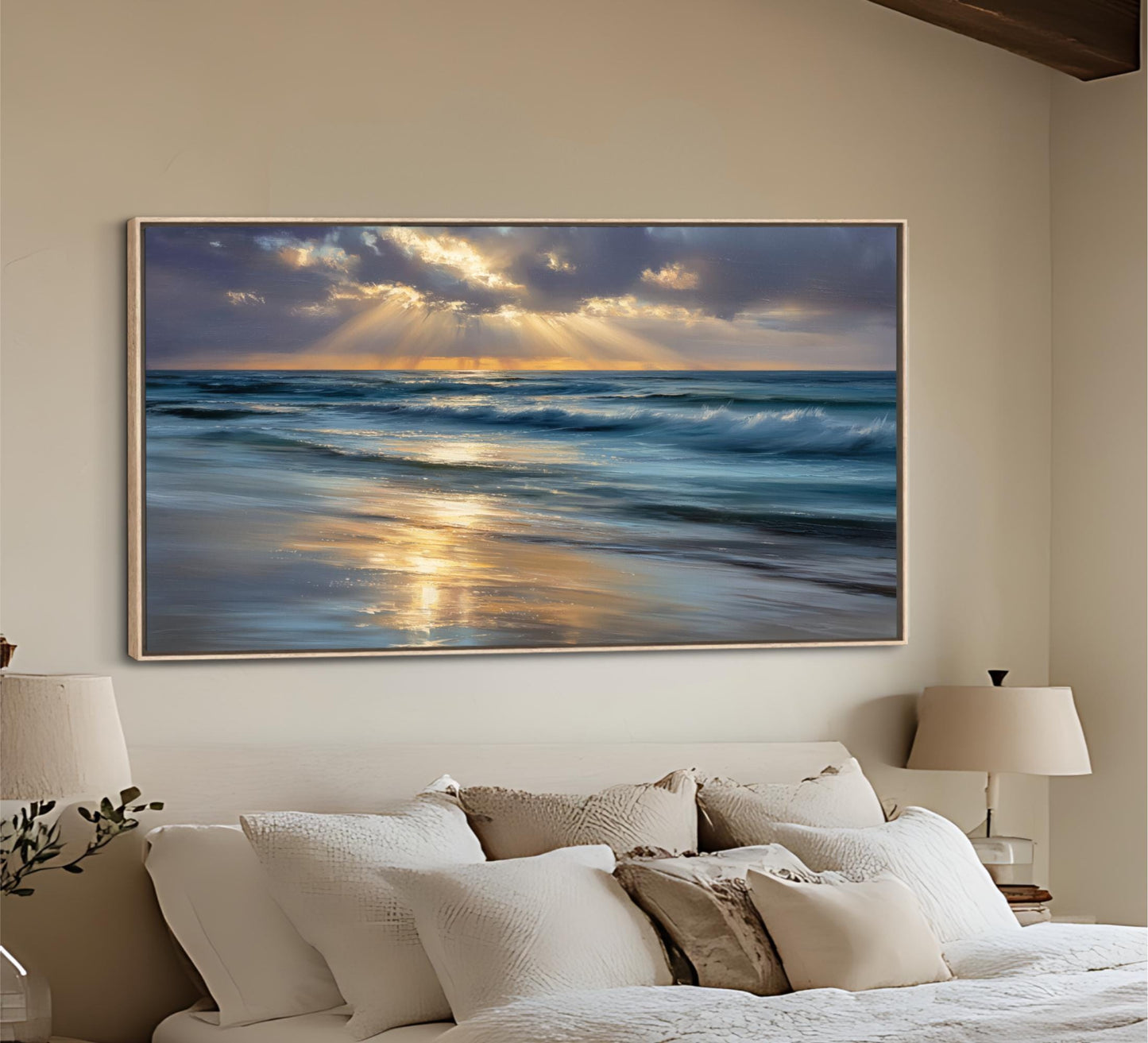 a large framed painting of a serene beach scene with waves crashing against the shore, set against a backdrop of a cloudy sky with sunbeams shining through.