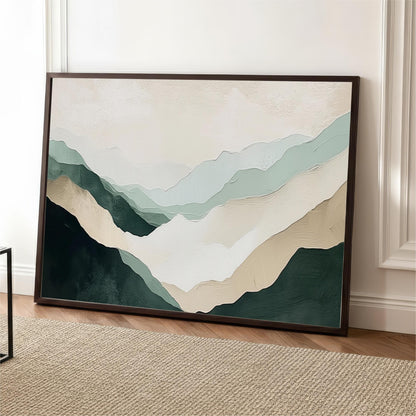 a large framed painting of mountains with a soothing color palette of green, beige, and gray.