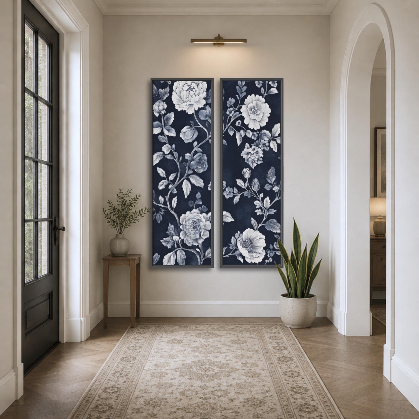 a hallway with a large floral painting hanging on the wall, a small table with a plant, and a rug on the floor.