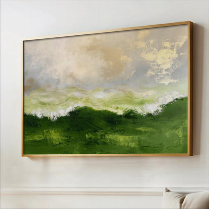 a large, framed painting of a landscape with green hills and a cloudy sky.