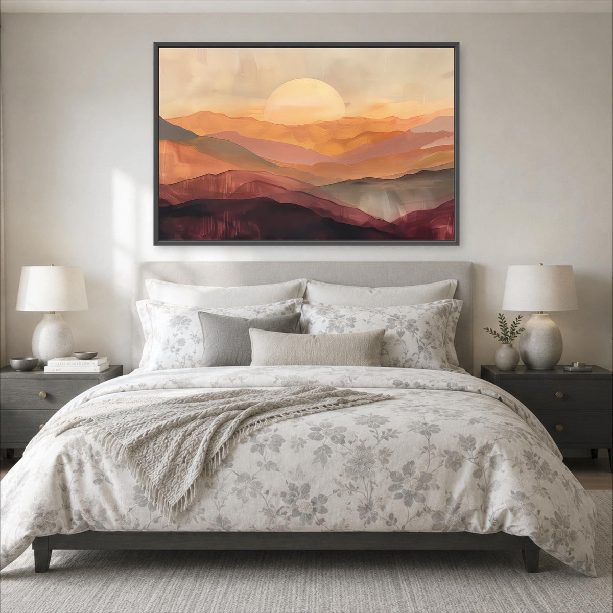 a serene bedroom scene with a large bed adorned with a floral comforter and pillows, flanked by two nightstands with lamps. Above the bed, a large framed painting of a sunset landscape adds a touch of nature and warmth to the room.