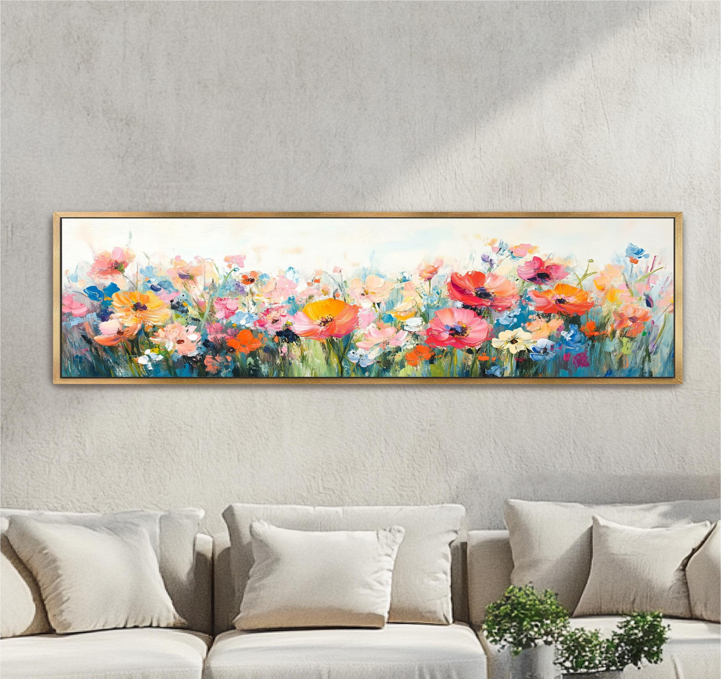 a large, colorful painting of a field of flowers hanging on a wall above a couch.