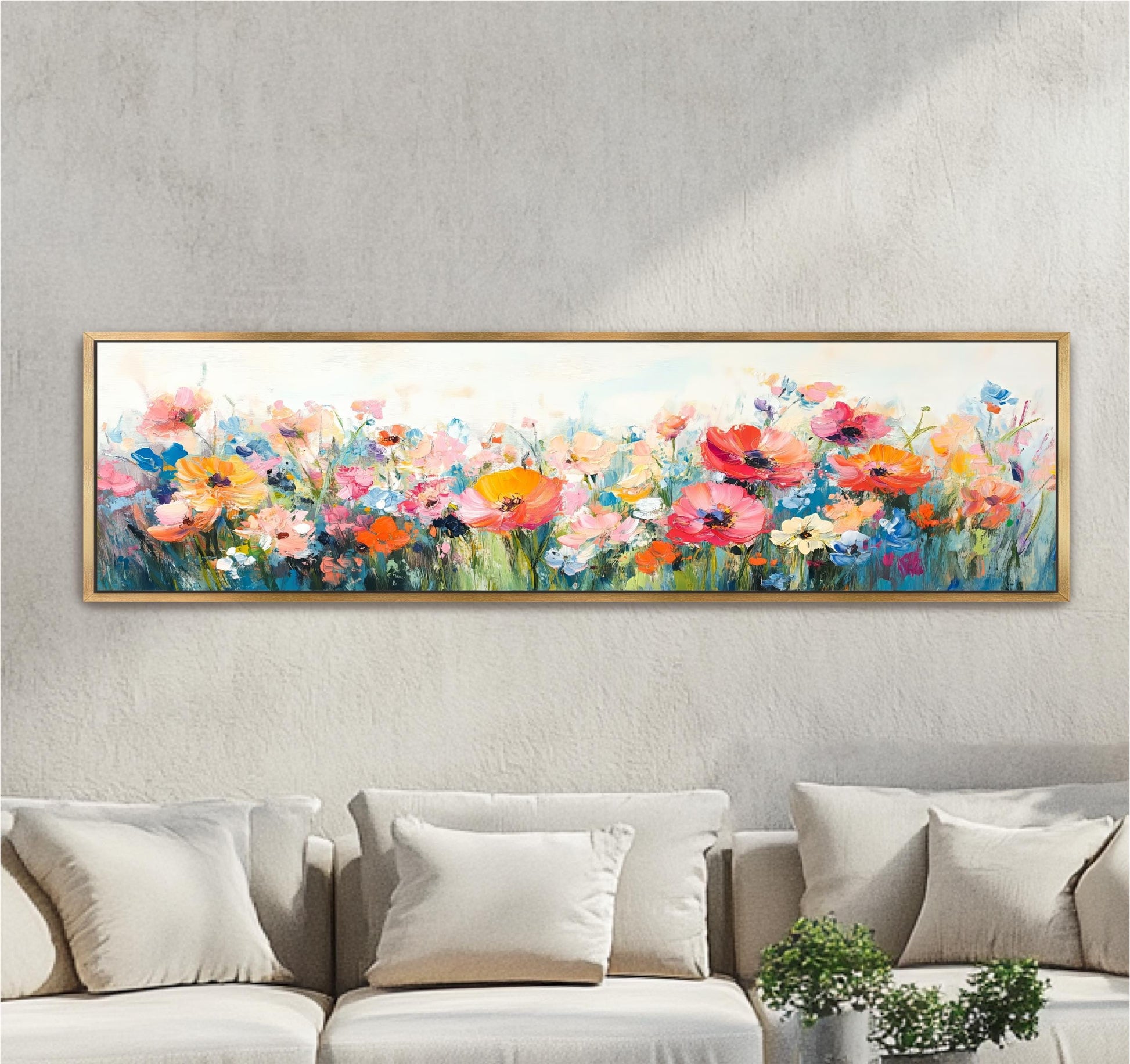 a large, colorful painting of a field of flowers hanging on a wall above a couch.