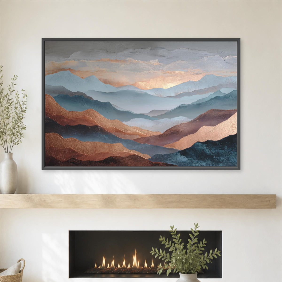 a large framed painting of mountains with a warm, golden glow, hanging above a fireplace with a plant on the mantel.