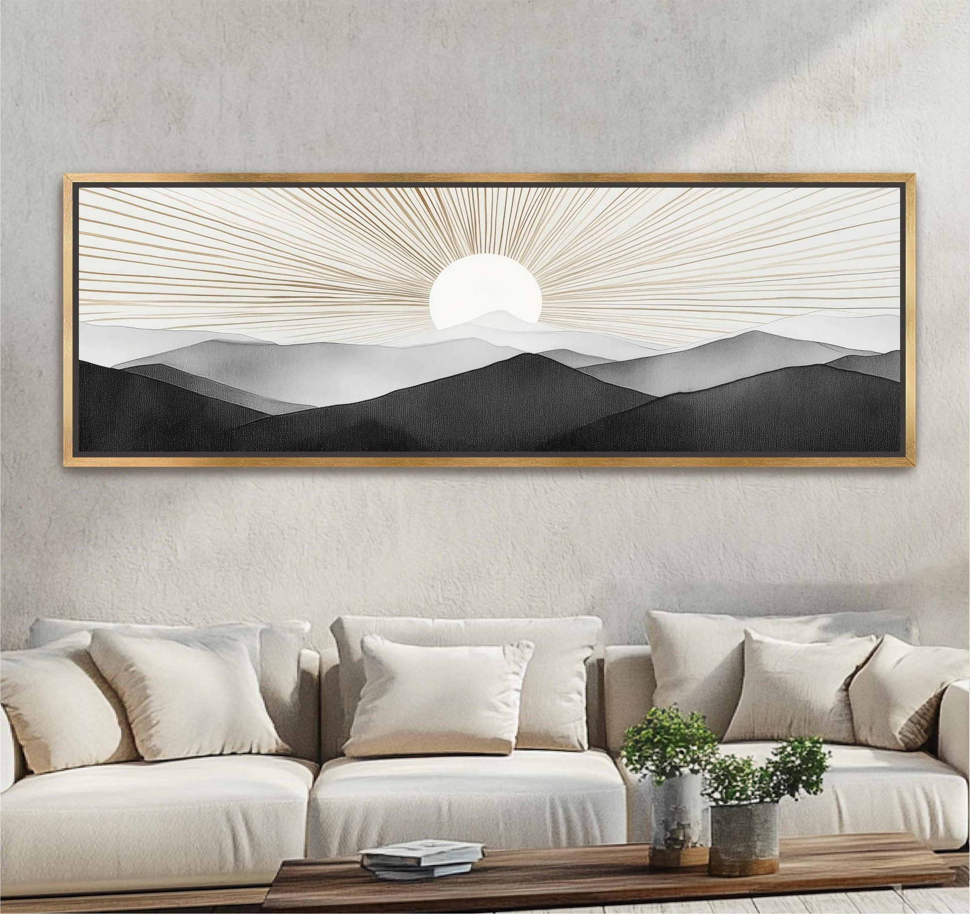 a large framed artwork depicting a serene landscape with mountains and a sun in the background, hanging on a wall above a beige sofa with white pillows.