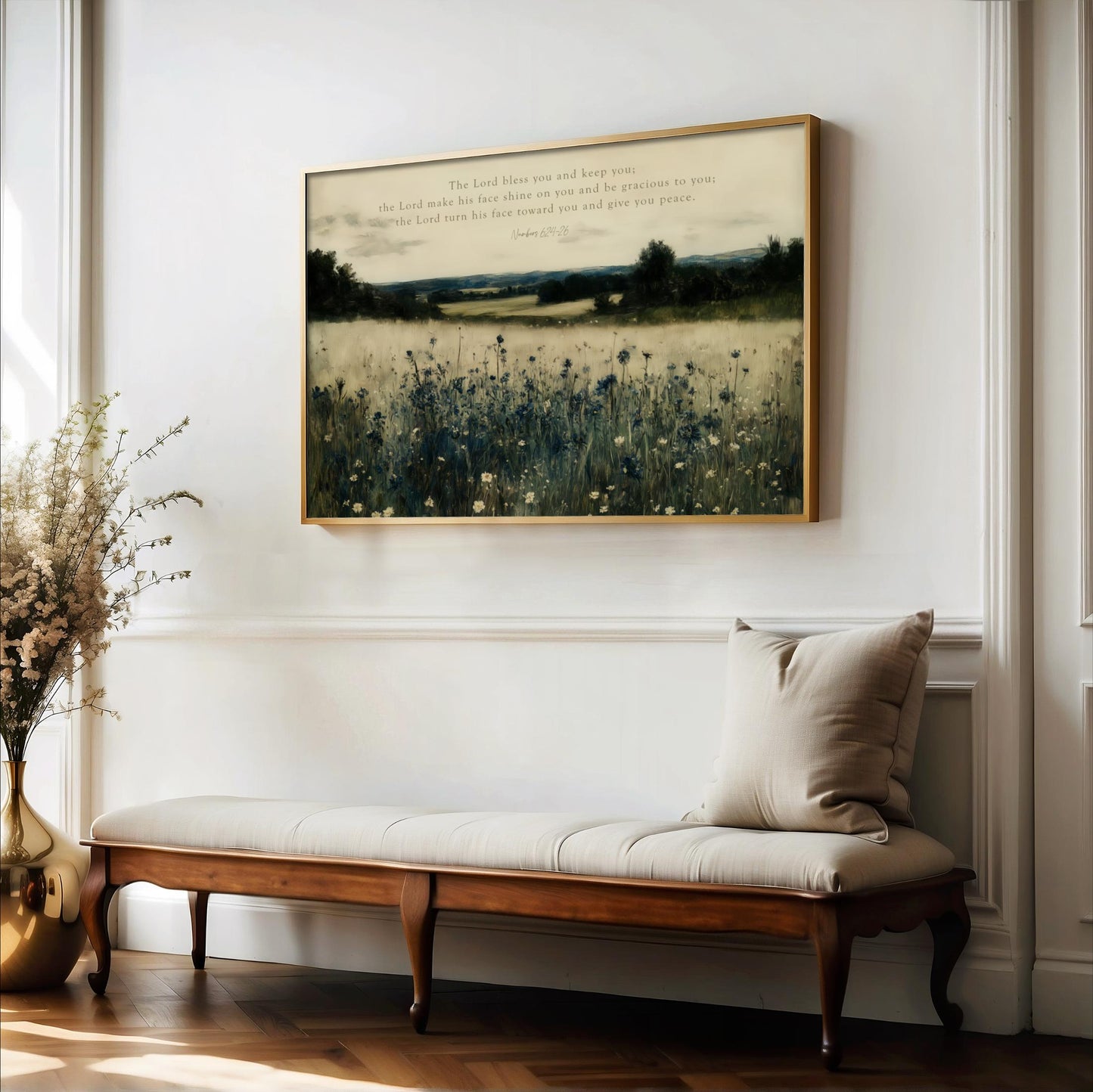 a serene indoor setting with a wooden bench, a vase of flowers, and a framed landscape painting hanging on the wall.