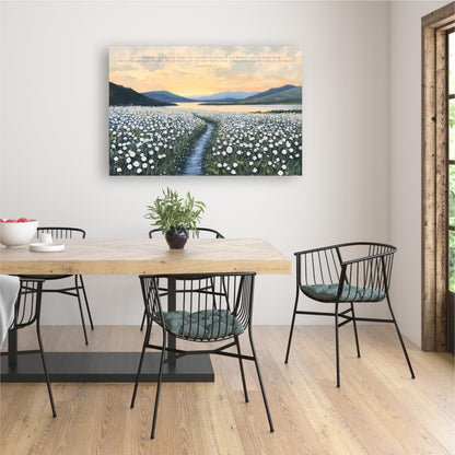 a dining room with a wooden table and chairs, a potted plant on the table, and a large painting of a field of flowers hanging on the wall above the table.