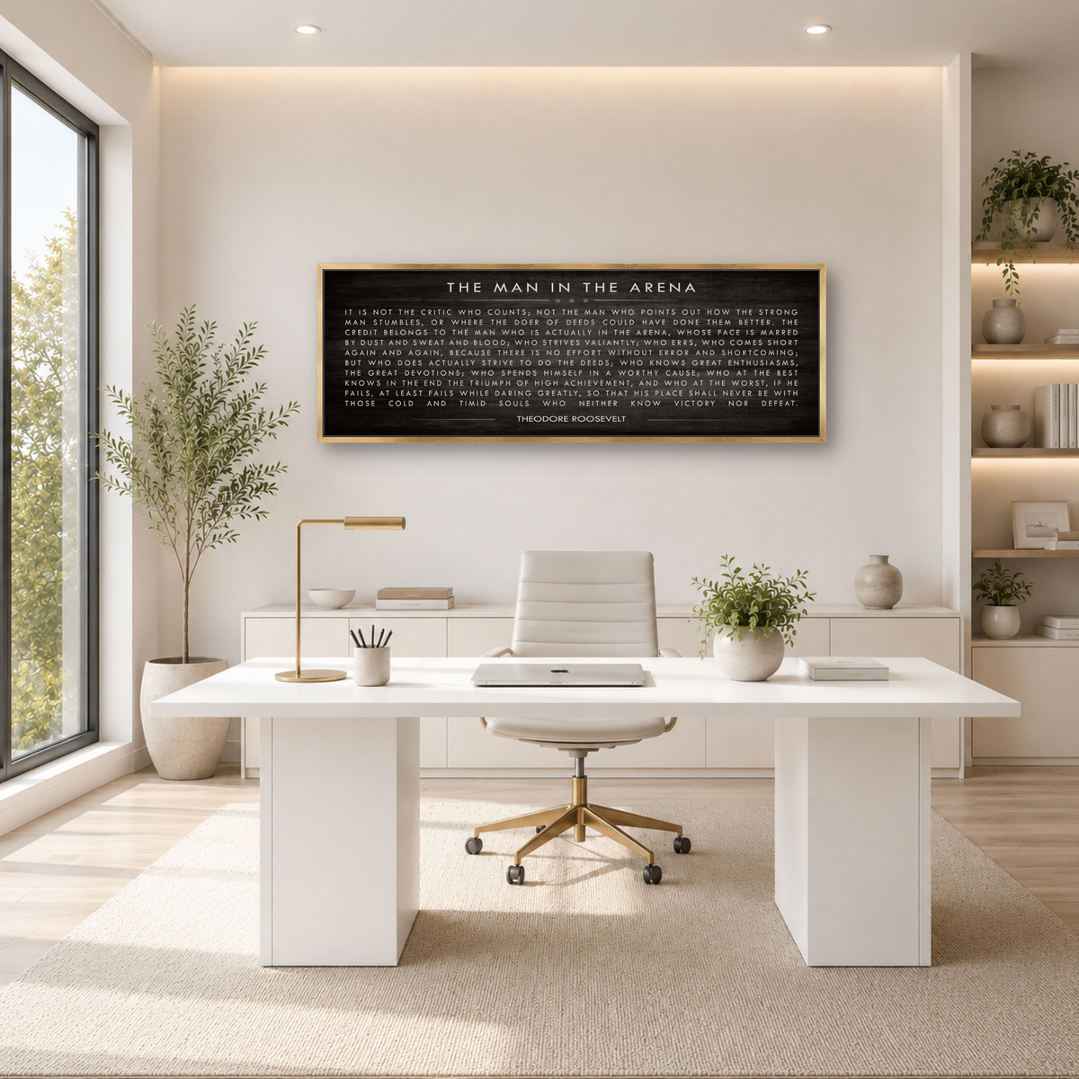 a modern, minimalist office space with a large window, white desk, and a framed quote on the wall.