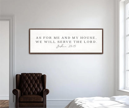 a framed inspirational quote on a white wall, which reads "As for me and my house, we will serve the Lord."