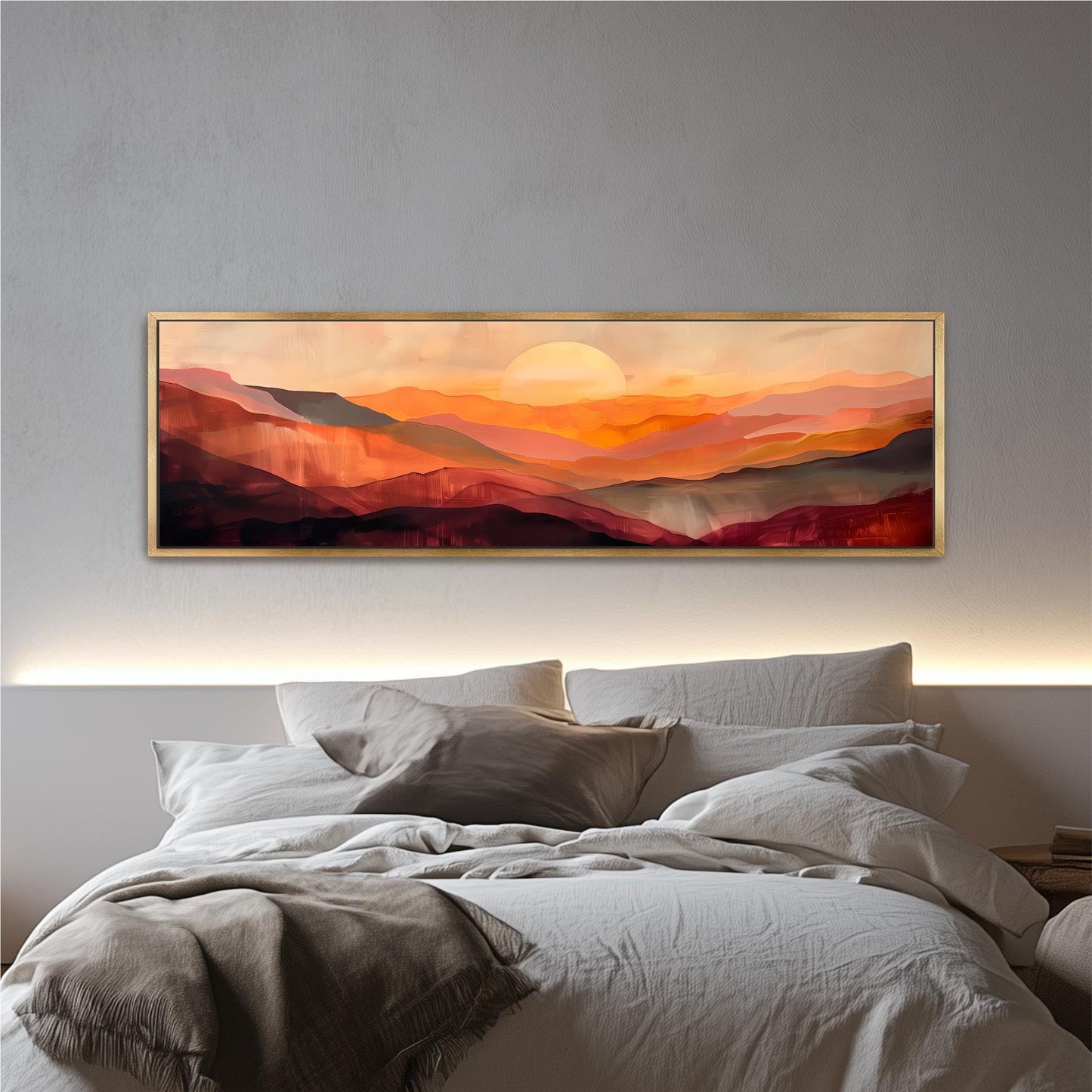 a large, framed painting of a mountainous landscape with a warm, sunset-like sky above.