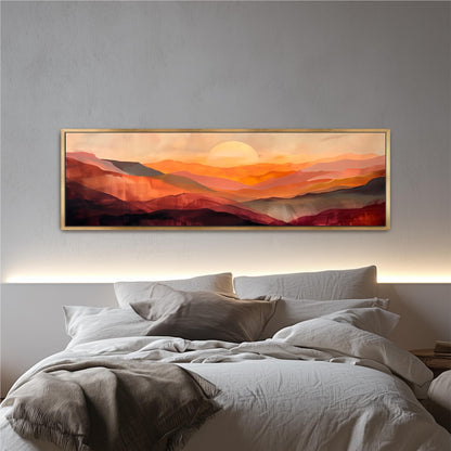 a large, framed painting of a mountainous landscape with a warm, sunset-like sky above.
