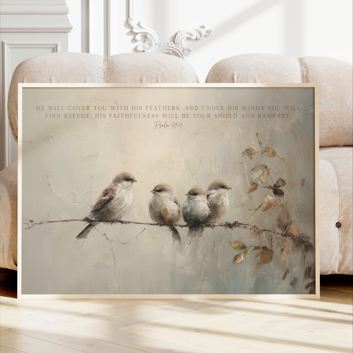 A framed painting depicting four birds perched on a branch, with a text overlay that reads "He will cover you with his feathers, and under his wings you will find refuge. His faithfulness will be your shield and rampart."
