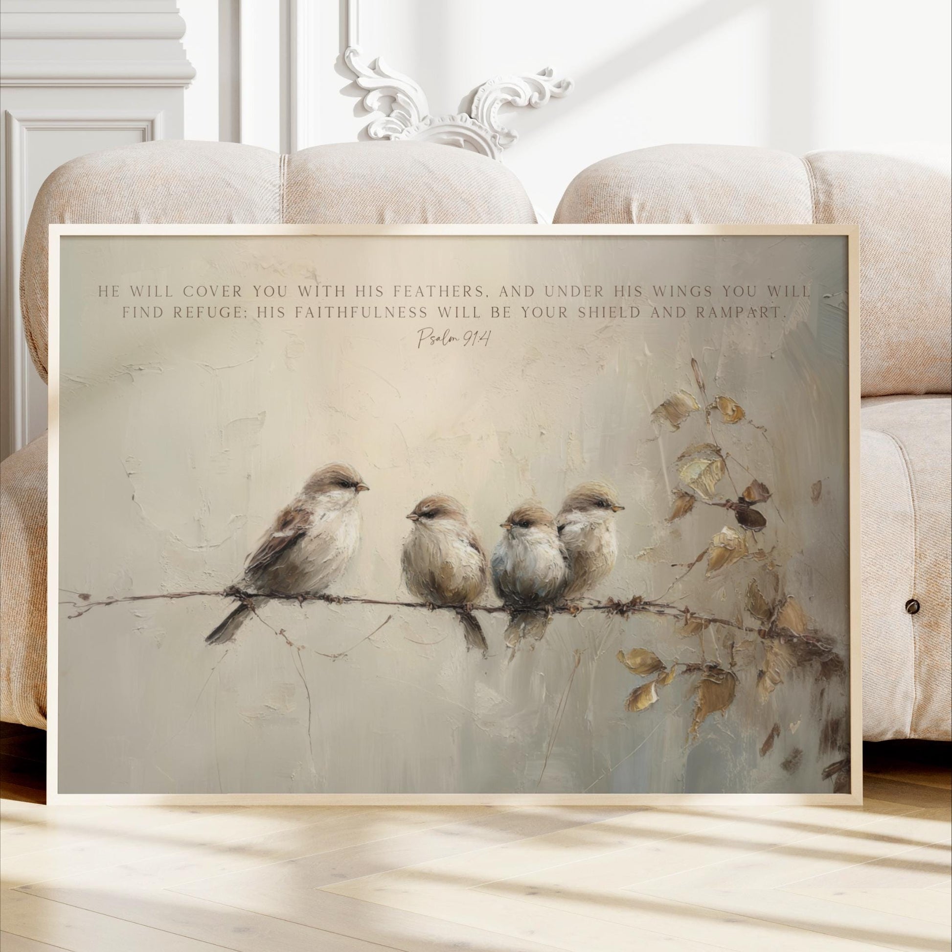 A framed painting depicting four birds perched on a branch, with a text overlay that reads "He will cover you with his feathers, and under his wings you will find refuge. His faithfulness will be your shield and rampart."