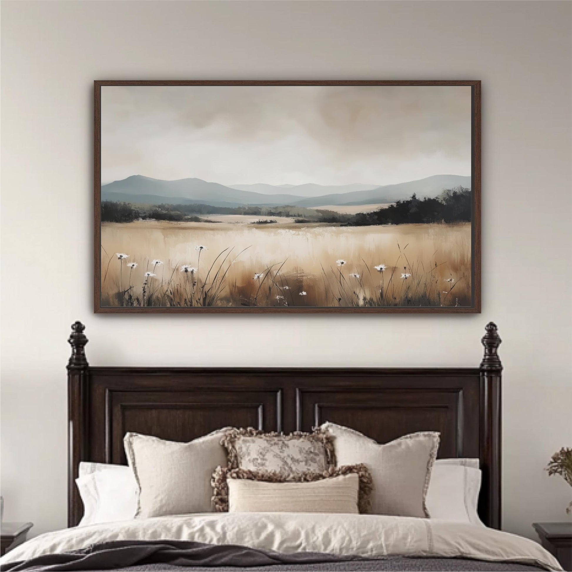 a large landscape painting hanging above a bed with a wooden headboard.