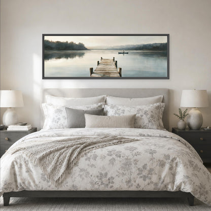 a large bedroom with a bed, nightstands, and a framed landscape painting depicting a dock leading to a lake.
