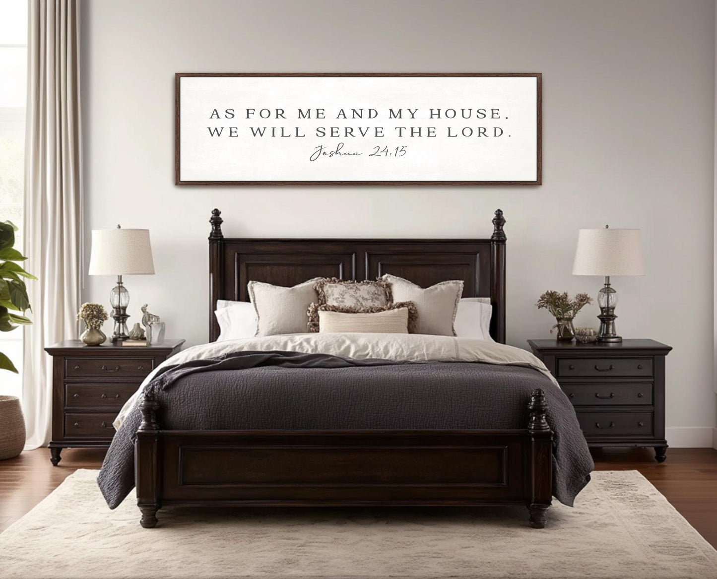 a bedroom with a large wooden bed, a nightstand on each side, and a framed inspirational quote above the bed.