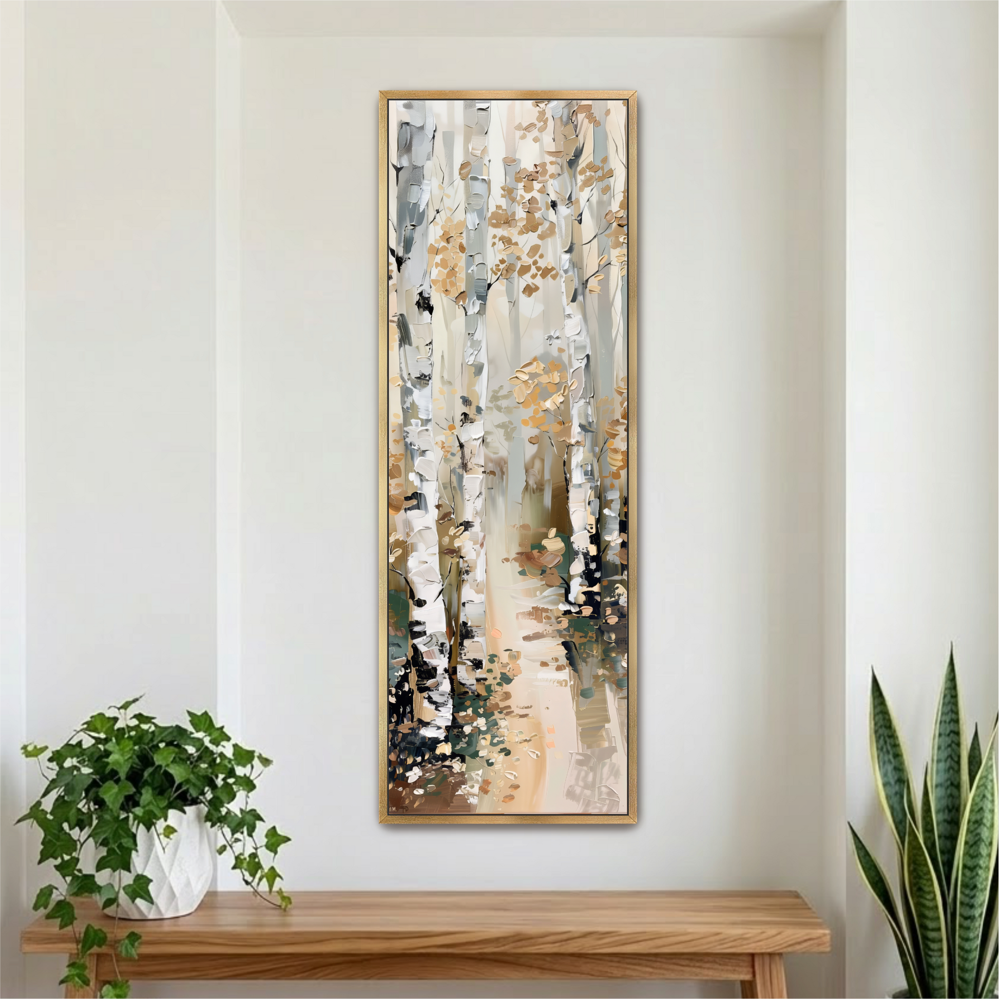 a large framed painting of a forest scene with birch trees and a path, hanging on a white wall above a wooden table with a potted plant on it.