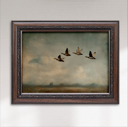 A framed painting depicting four ducks flying in formation against a cloudy sky.