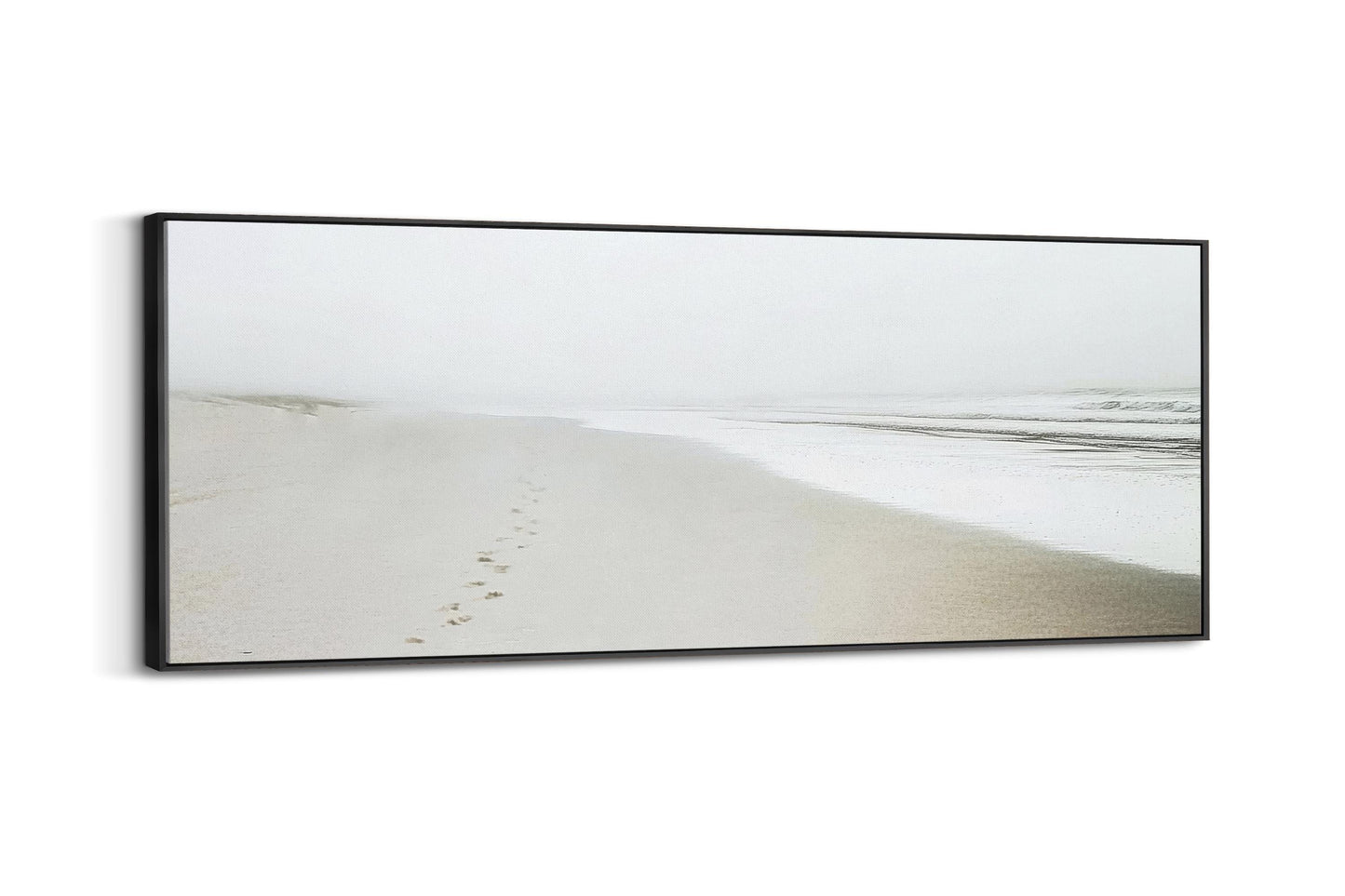 a picture of a beach with footprints in the sand