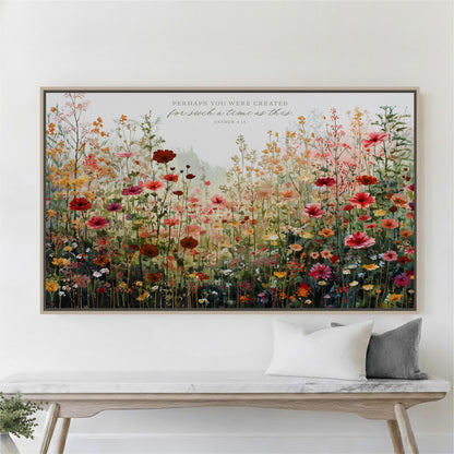 a large, colorful painting of a field of flowers hanging on a wall above a wooden bench.