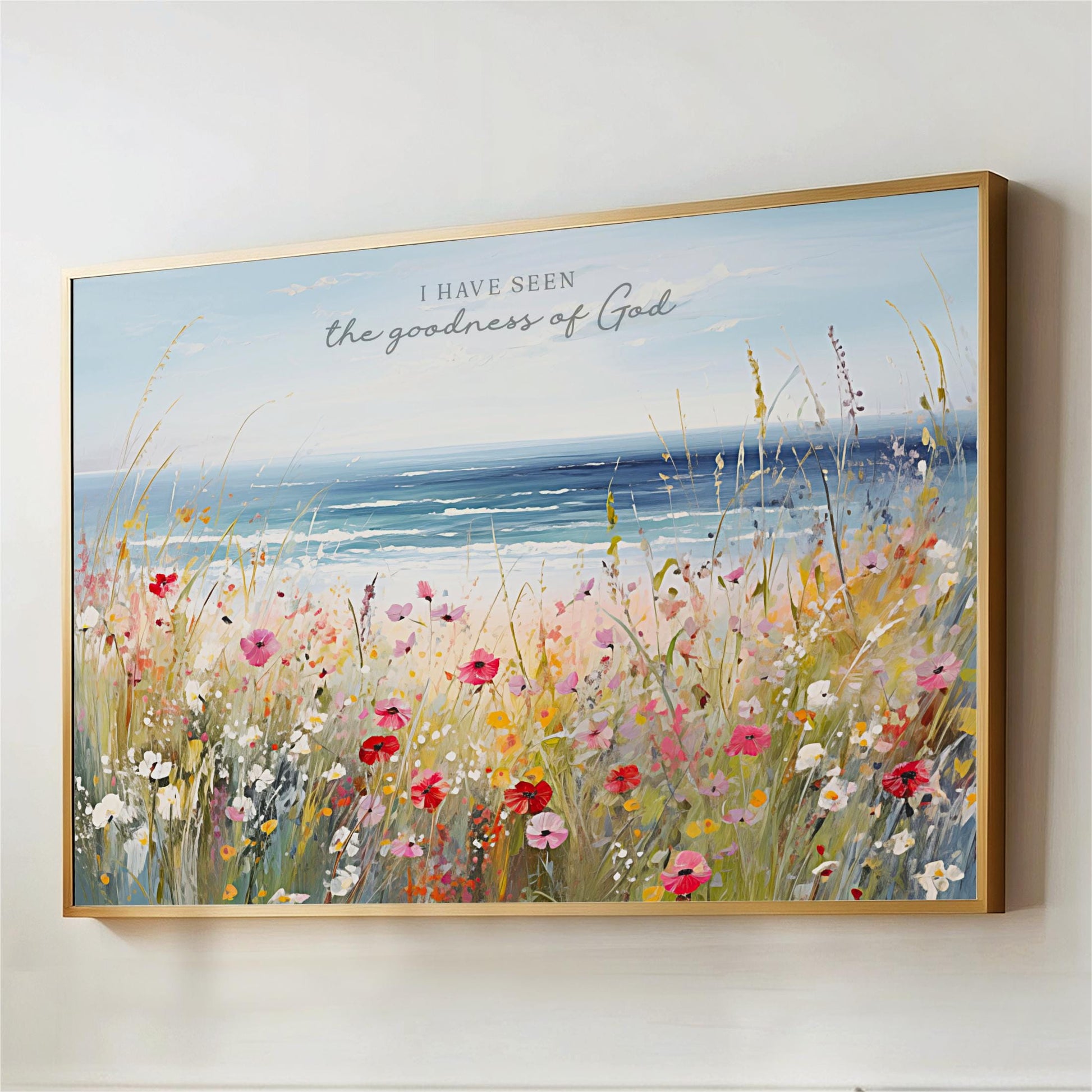The image is a framed painting depicting a vibrant field of colorful flowers, with a serene body of water in the background.