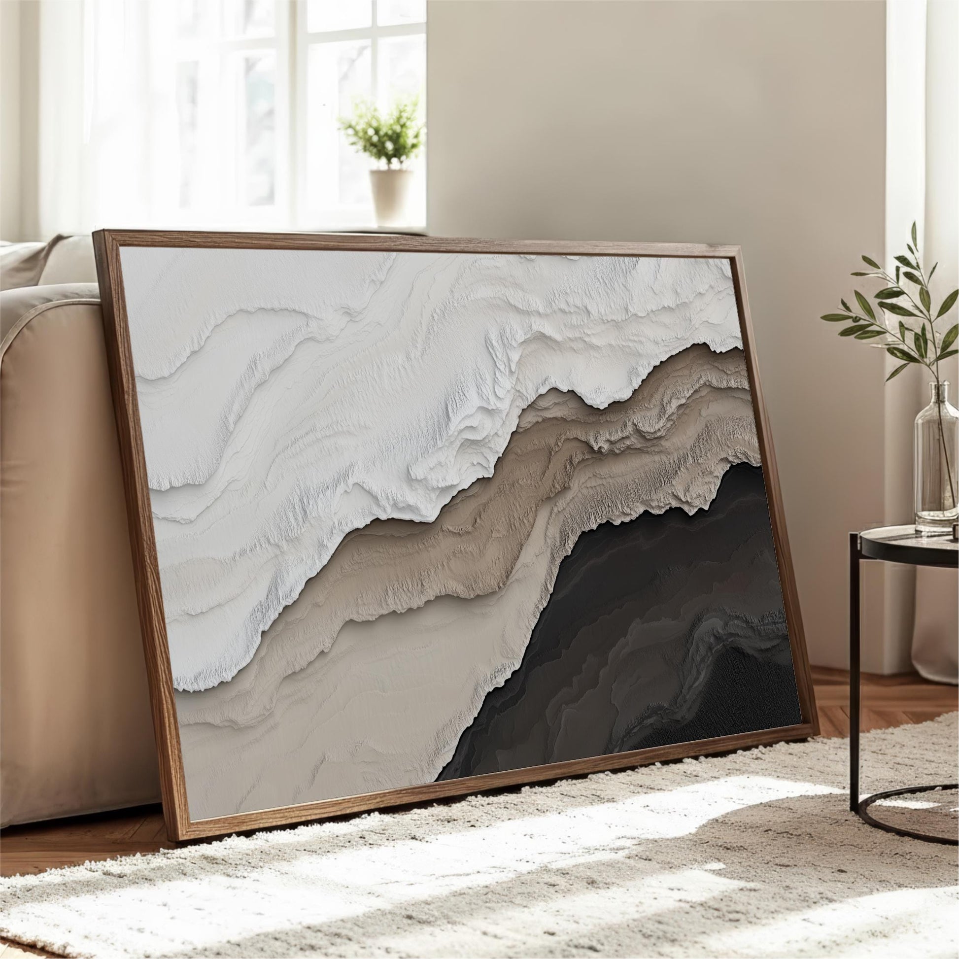 a large, framed artwork depicting a landscape with a mountain range, displayed in a living room setting.
