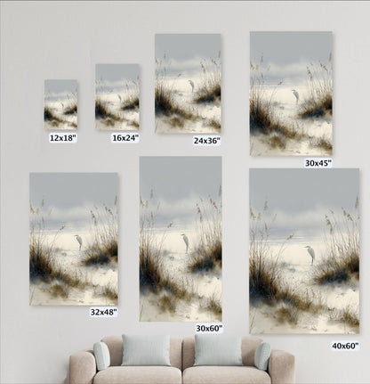 a collection of framed photographs of a serene beach scene, including a bird standing on the sand and tall grasses in the background. The photographs vary in size, with some being smaller than others, and are arranged in a grid-like pattern on the wall.