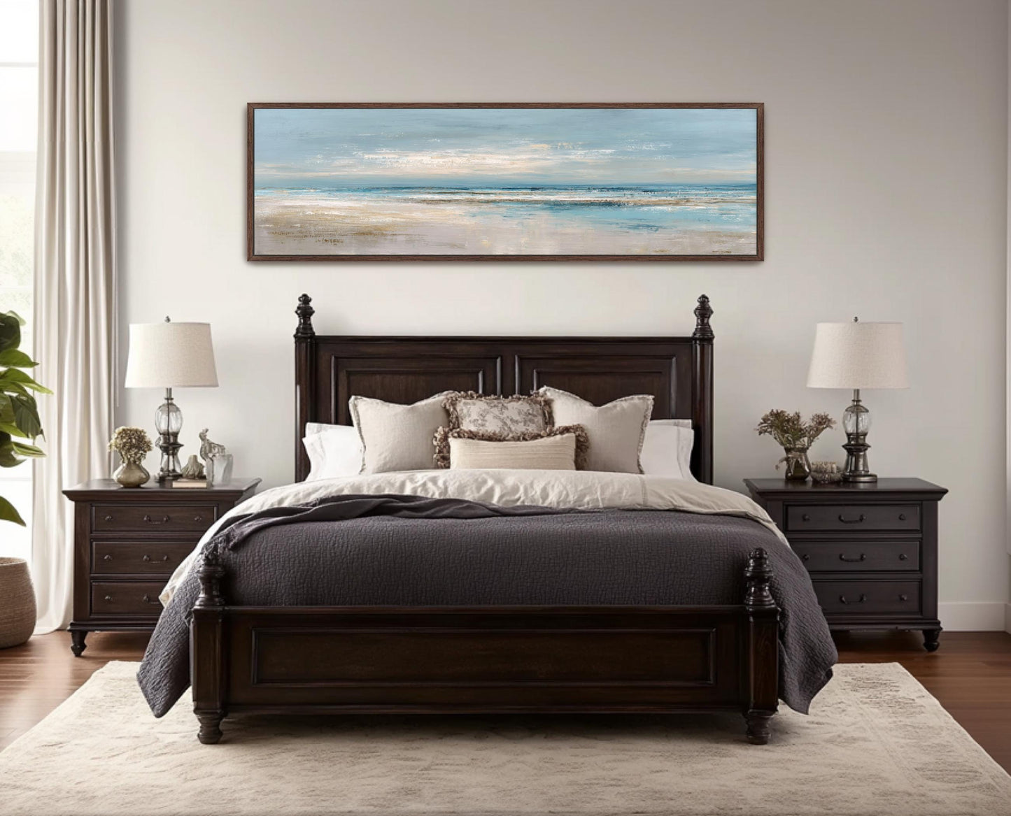 a serene bedroom scene with a large bed, dark wood furniture, and a painting of a beach landscape hanging above it.
