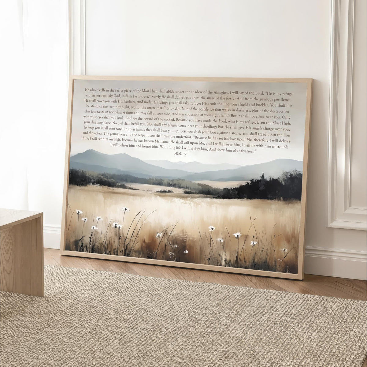 a framed painting of a serene landscape with a field of tall grass and a body of water in the background.