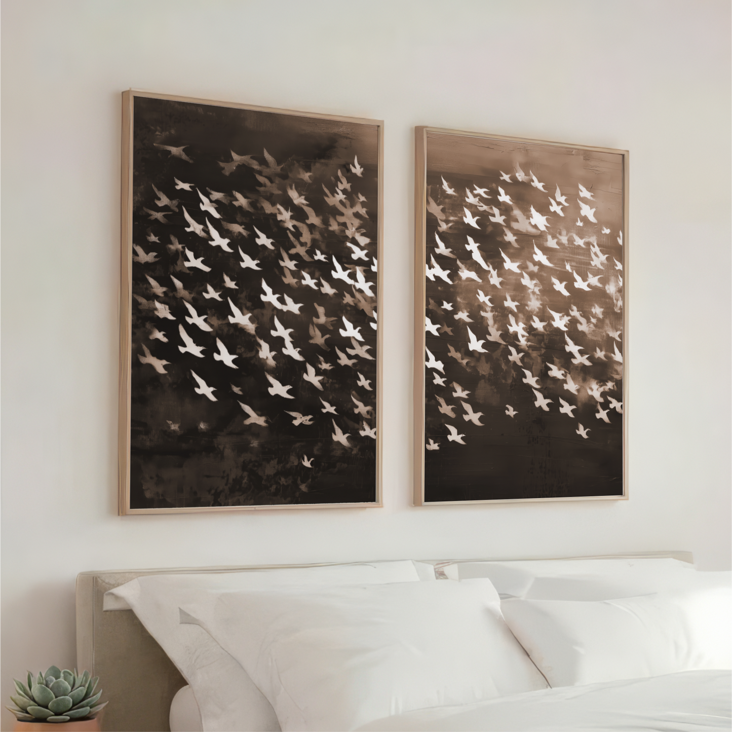 a bedroom setting with two large framed paintings hanging on the wall above a bed. The paintings depict a flock of birds in flight, creating a sense of movement and energy in the room.