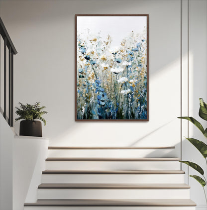 a painting of flowers hanging on a wall, with a staircase below it.