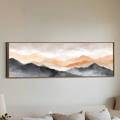 a large, framed painting of a mountain landscape hanging on a wall.