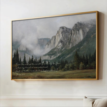 The image is a framed painting depicting a mountainous landscape with a forested area and misty peaks in the background.