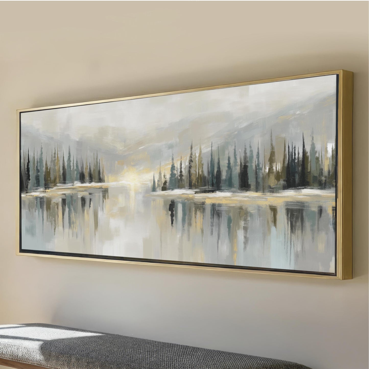 a large, framed painting depicting a serene landscape with a lake and trees reflected in the water.