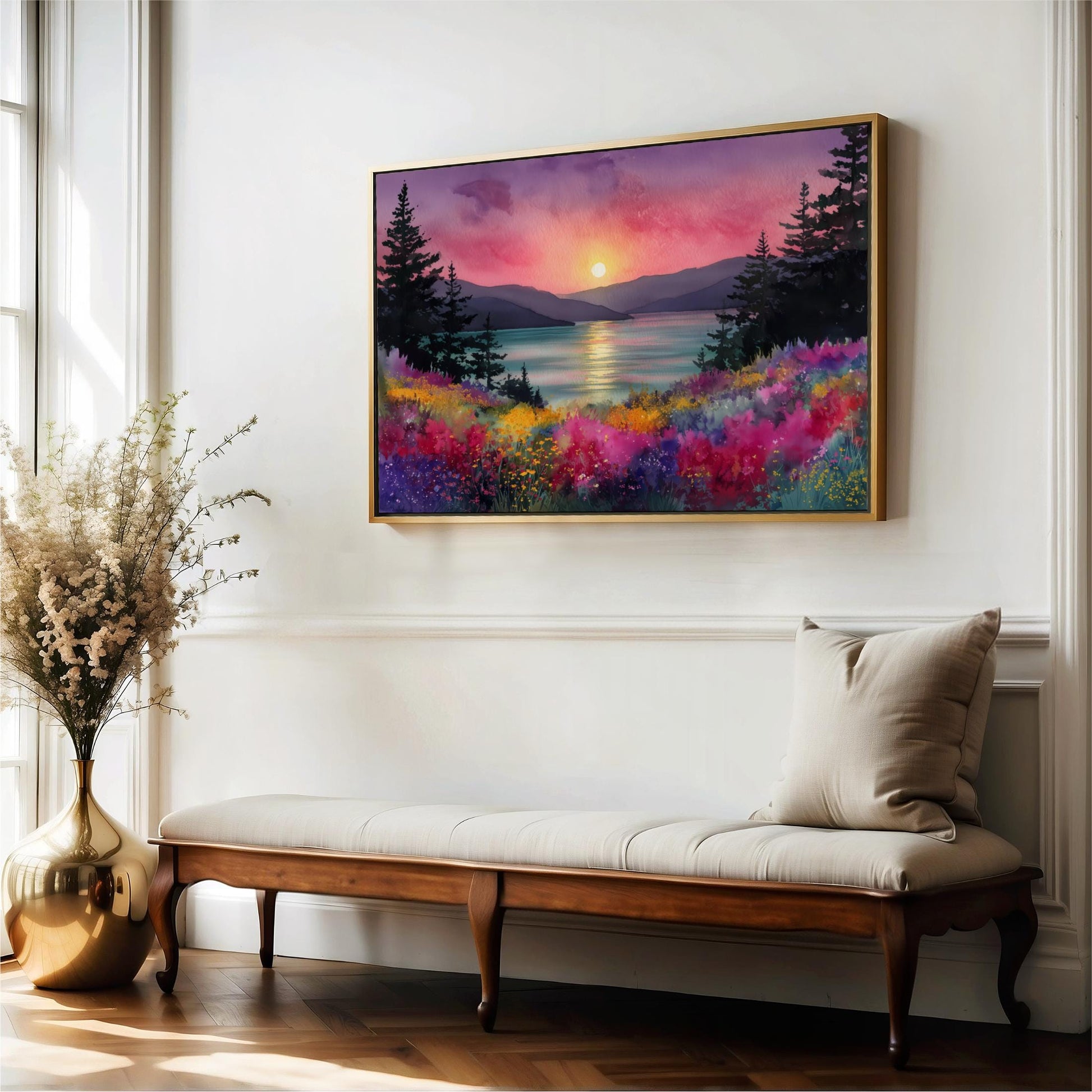 a large, colorful painting of a sunset landscape hanging on a white wall above a wooden bench.